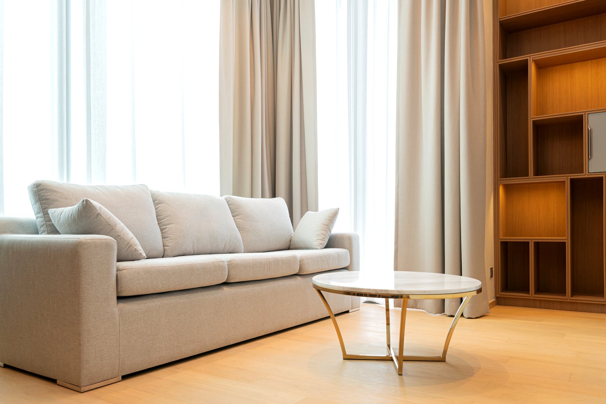 Made-to-measure curtains dressing a bright living room window